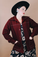 Women's or men'd vintage 1970's size medium long sleeve maroon color button up lightweight western style jacket with pockets and contrast stitching.