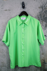 Women's vintage 1980's Collection by Shirq, New York, Made in USA label short sleeve bright lime green button up blouse with collar and shiny trim in a lightweight poly material.