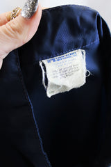 Men's or women's vintage 1980's Horizon Sportswear Inc., Made in USA label long sleeve navy blue nylon zip up windbreaker jacket with red and white vertical stripe down the front and patches.