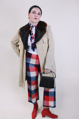 Men's or women's vintage 1970's tan suede long length long arm jacket with brown fur trim around collar. Matching suede belt.