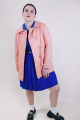 Women's vintage 1970's peach pink colored leather double breasted pea coat. Double lapel, pockets, and fully lined.
