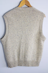Men's or women's vintage 1970's Jantzen, Made in USA label sleeveless button up sweater vest cardigan in a wool and acrylic material. Oatmeal color with navy speckles and a cable knit texture.