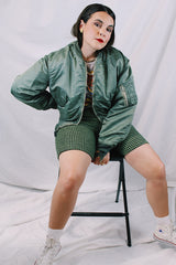 Men's or women's army zip up bomber jacket with long sleeves. Army green color with orange satin liner. Reversible.