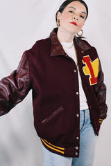 Men's or women's vintage 1980's Settlemien's label long sleeve maroon varsity letterman jacket with a yellow patch and trim.