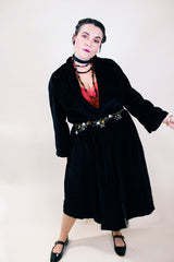 Women's vintage 1960's ankle length long sleeve black velvet duster jacket. Fully lined and has two side pockets.