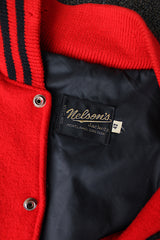 Men's vintage 1987 Nelson's Jackets, Portland, Oregon label long sleeve cream and red colored varsity letterman jacket in wool and nylon material. Has patches and pins.