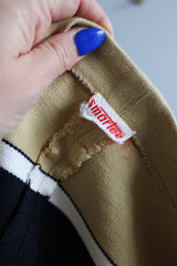 Women's vintage 1980's Smartee label capped sleeved short cropped top with a boat neck and has black, white, and beige stripes.