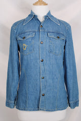 Women's vintage 1970's Montgomery Ward label long sleeve medium wash denim chambray top with snapper buttons.