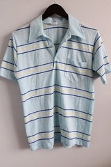 Women's or men's vintage 1980's Campus Pro Action label short sleeve light blue striped polo tee with half button closure and collar.