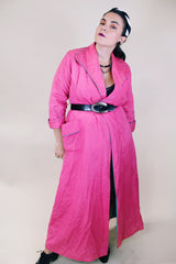 Women's vintage 1950's Lyn Delle label long sleeve long length bright pink quilted robe jacket with teal colored trim.