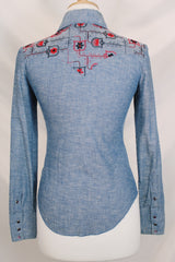 Women's vintage 1970's Western Trends by Panhandle Slim, Made in USA label long sleeve chambray denim top with black and white embroidery.
