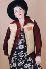 Men's vintage 1980's Swingster, World of Wearables, Made in USA label size medium sleeveless tan suede vest with a cream shearling liner and brass zipper up the front.