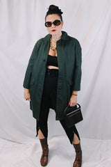 Men's or women's vintage 1960's Brent Prep Sold Exclusively by Montgomery Ward long sleeve long length cotton material lightweight trench coat in a dark green and all over subtle plaid print.