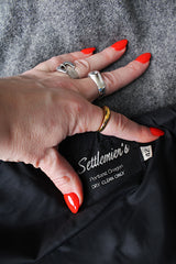 Men's or women's vintage 1980's Settlemein's, Portland, Oregon label long sleeve navy and grey varsity letterman jacket in wool, leather, and nylon. Snap buttons and hood.