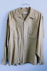 Men's vintage 1950's Viyella, Manhattan label long sleeve button up shirt with collar and two chest pockets in a tan mustard yellow color.