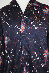 Men's vintage 1970's Maxi & Me California label long sleeve black slinky polyester material button up shirt with all over multi colored paint splatter print.