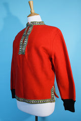 Women's vintage 1960's Product of Norway, Manufactured by Petersen & Dekke label Norwegian style pullover sweater in red wool with decorative trim and metal clasp closures