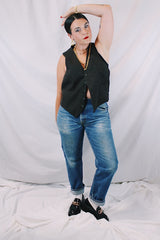Men's or women's vintage 1970's sleeveless chocolate brown waistcoat vest in a wool and rayon mix material. Tortoise buttons and front pockets.