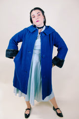 Women's vintage 1960's Jack Bloom California label long sleeve royal blue color coat. Ankle length with grey fur trim around collar and cuffs.