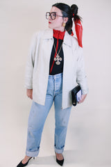 Women's vintage 1990's Worthington label long sleeve bone white leather jacket with a collar, a zipper up the front, and two side pockets.