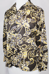 Women's vintage 1970's long sleeve button up blouse with a dagger collar in chocolate brown and tan colored all over abstract print.