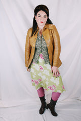 Women's vintage 1970's Made in Belgium label long sleeve light tan colored leather lightweight jacket with silver snap buttons and a dagger collar.