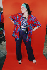 Men's vintage 1970's Michael Gerald Ltd., Hand Screened short sleeve button up shirt in an all over Hawaiian print with parrots.