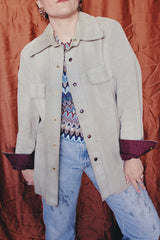Women's or men's vintage 1970's Styled by William Barry label long sleeve grey colored suede jacket with maroon colored liner and popper buttons.