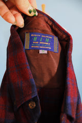 Men's vintage 1960's Quality Tailoring, Him, Made in Japan label short sleeve button up plaid shirt in a wool and nylon blend material. Navy and maroon colors.