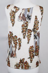 Women's vintage 1970's matching novelty print sleeveless tank top and button up blouse with dagger collar. All over novelty print in white and brown colors.