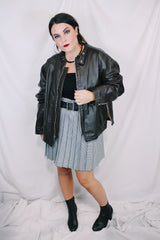 Men's or women's vintage 1980's Kirk's Suede Life label long sleeve oversized dark chocolate brown leather bomber jacket with zipper front closure.