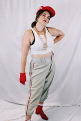 Men's vintage 1940's Rawlings, St. Louis label capri length baseball pants in grey wool material with red stripe piping along each side of leg.