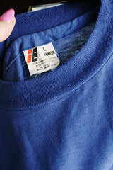 Women's or men's vintage 1970's E, IMEX, Made in Mexico label short sleeve blue tee with white slogan on the front in a cotton or polyester material.
