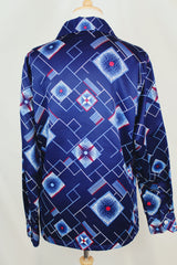 Men's vintage 1970's Da Vinci Presents Delfina label long sleeve vibrant navy blue button up shirt with all over white and red abstract print in thick polyester material.