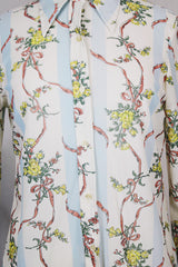 Women's vintage 1970's Knit Editions by Ship 'n Shore long sleeve button up blouse with a dagger collar in an all over white and blue stripes pattern and floral print.