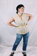 Men's or women's vintage 1970's Norsewear, Made in New Zealand label sleeveless zip up wool material vest in an oatmeal cream color. Ribbed texture all over.