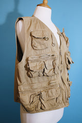 Men's or women's vintaGe 1980's Wild Life Brand, Fishing Vest label sleeveless light tan colored zip up vest in a cotton material. Has multiple pockets in the front.