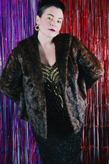 Women's vintage 1960's Fur Salon, M & T label long sleeve dark brown real fur evening jacket. No front closure, two side pockets and fully lined.