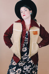 Men's vintage 1980's Swingster, World of Wearables, Made in USA label size medium sleeveless tan suede vest with a cream shearling liner and brass zipper up the front.