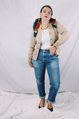 Women's vintage 1960's A Genuine Dehen, The Buddy label long sleeve light tan colored button up cardigan sweater. Ribbed texture cuffs and two front pockets.