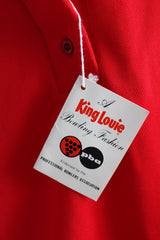 Women's vintage 1970's King Louie Creation, Made in USA label short sleeve red bowling top with half button closure, collar, and a pocket in polyester.