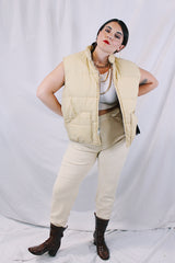 Women's or men's vintage 1970's A & M Industries, Seattle, Washington label sleeveless zip up puffer vest. Cream colored exterior, brown colored interior.