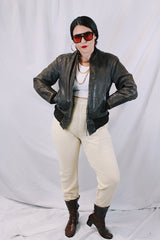 Men's or women's vintage 1950's Genuine Horsehides All Weather Garment, San Francisco, California label long sleeve brown leather bomber jacket with ribbed knit trim and quilted liner.