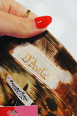 Men's vintage 1970's D'Avila label long sleeve button up shirt in all over abstract orange and green abstract print in slinky polyester material.