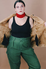 Women's vintage 1970's size medium long sleeve tan brown suede jacket with one button closure, cream fur trim, and black trim throughout.