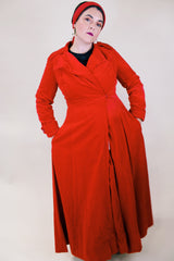 Women's vintage 1950's/60's Count Romi LTD., Your All Weather Traveler label long sleeve long length bright red velvet duster coat. One closure at waist.