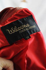 Women's or men's vintage 1980's Wilson's Suede & Leather long sleeve zip up short fit bright red leather moto style jacket.