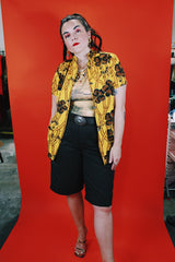 Women's vintage 1970's La Rosa, San Francisco label short sleeve button up blouse in yellow with all over brown Hawaiian print.