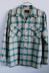 Men's vintage 1970's Towncraft, Penneys label long sleeve button up plaid shirt in tan color with blue and green plaid print. Chest pockets.