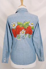 Women's vintage 1970's long sleeve light blue chambray denim shirt with large strawberry print on the back.
